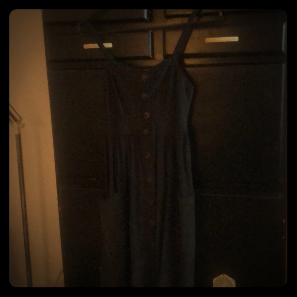 Sleeveless, green maxi dress with front buttons.